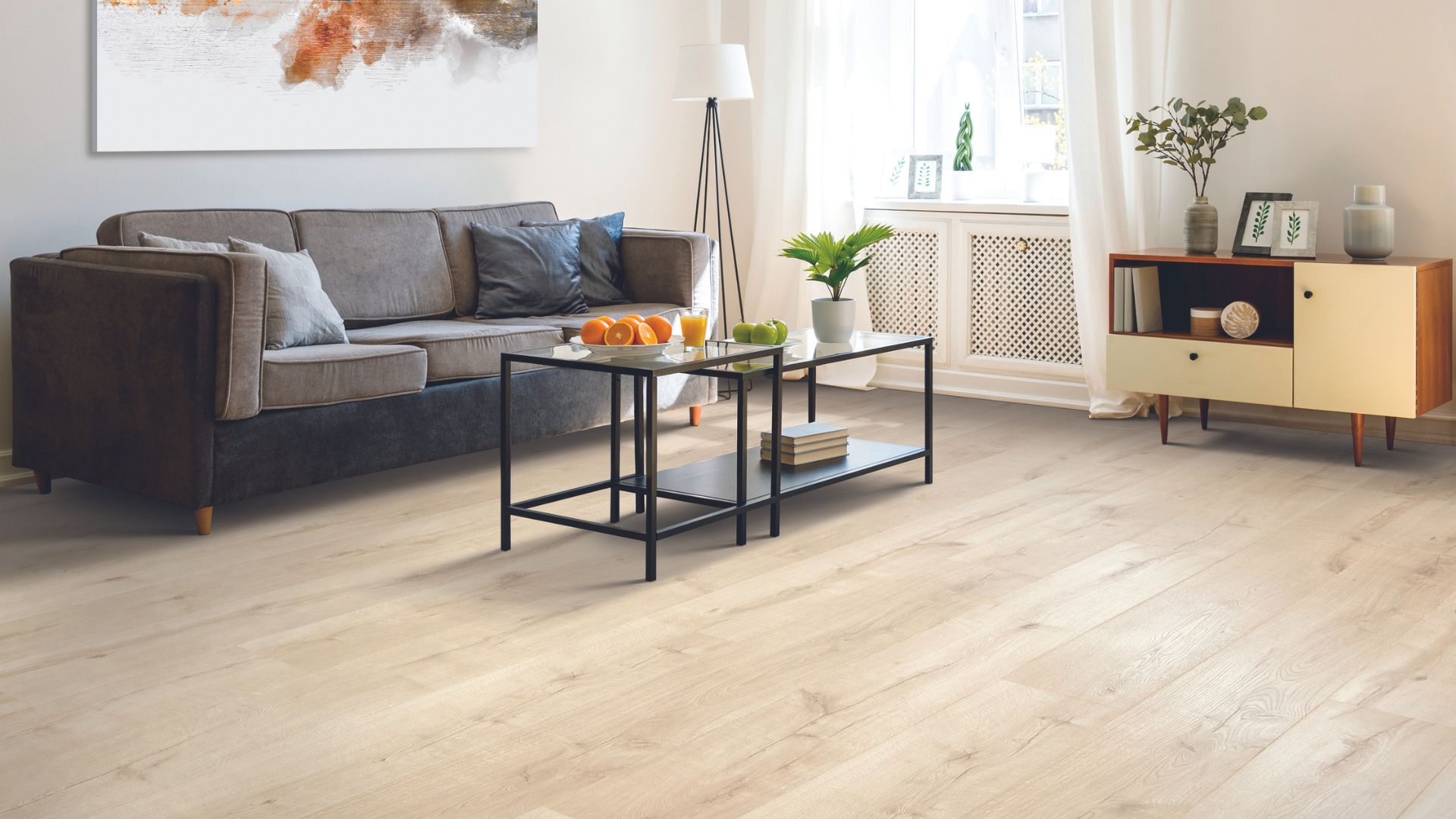 wood look laminate flooring in a cozy bright living room